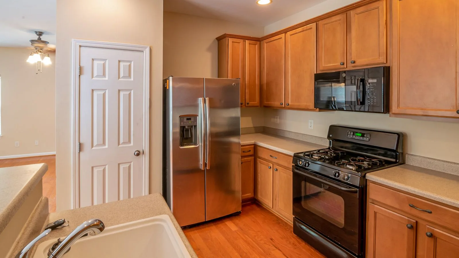 Kitchen interior with refrigerator, oven and modern appliances