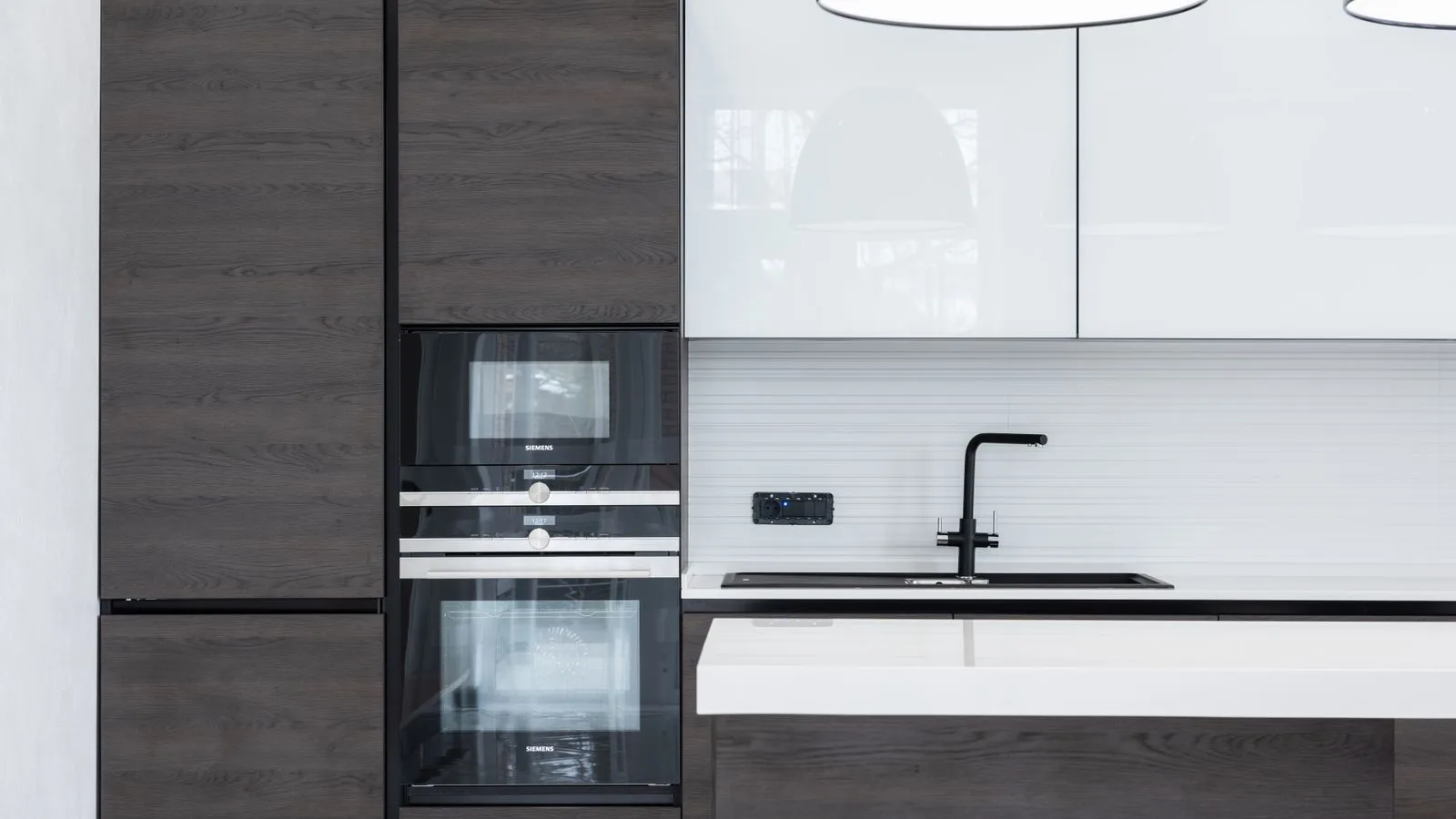 Modern kitchen with built-in oven and contemporary cabinetry