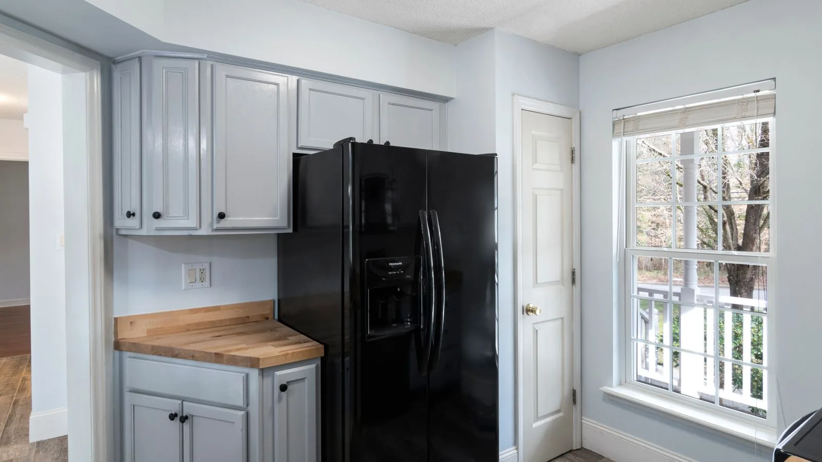 Refrigerator in a bright home kitchen with natural light
